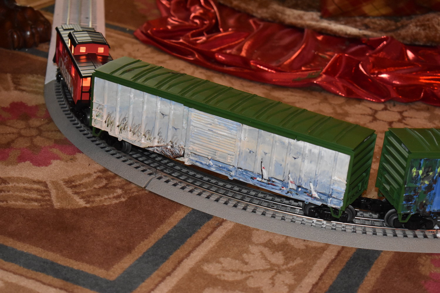 Ann Phillips Beard, a Madison artist and chief of staff to First Lady Elee Reeves, painted a Mississippi Christmas train for the Christmas tree in the Rose Room at the Governor’s Mansion. Each of the six trees at the Mansion has a toy train circling its base.